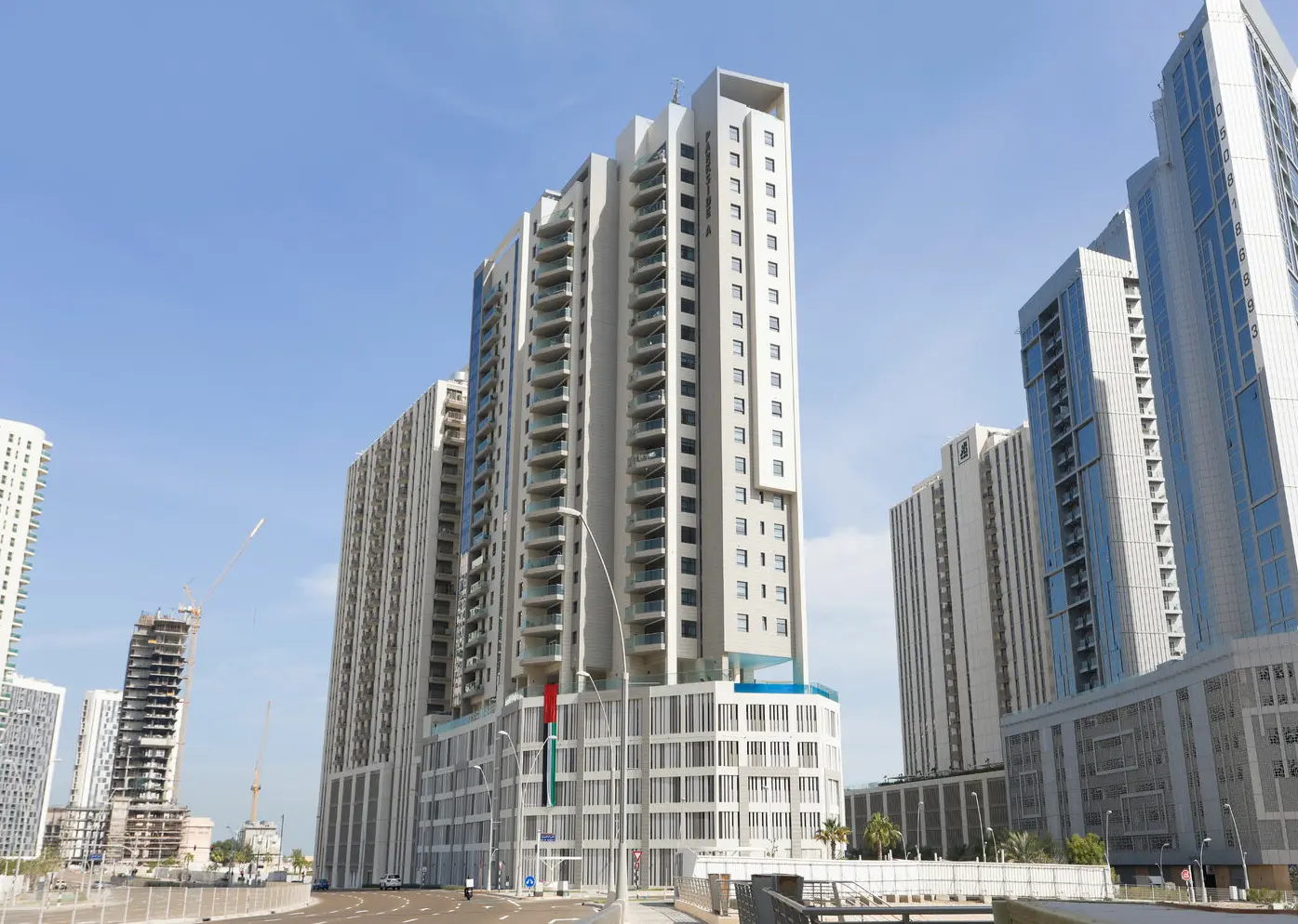 Contemporary glass and concrete high-rise exterior of Parkside Towers near Reem Central Park on Al Reem Island.