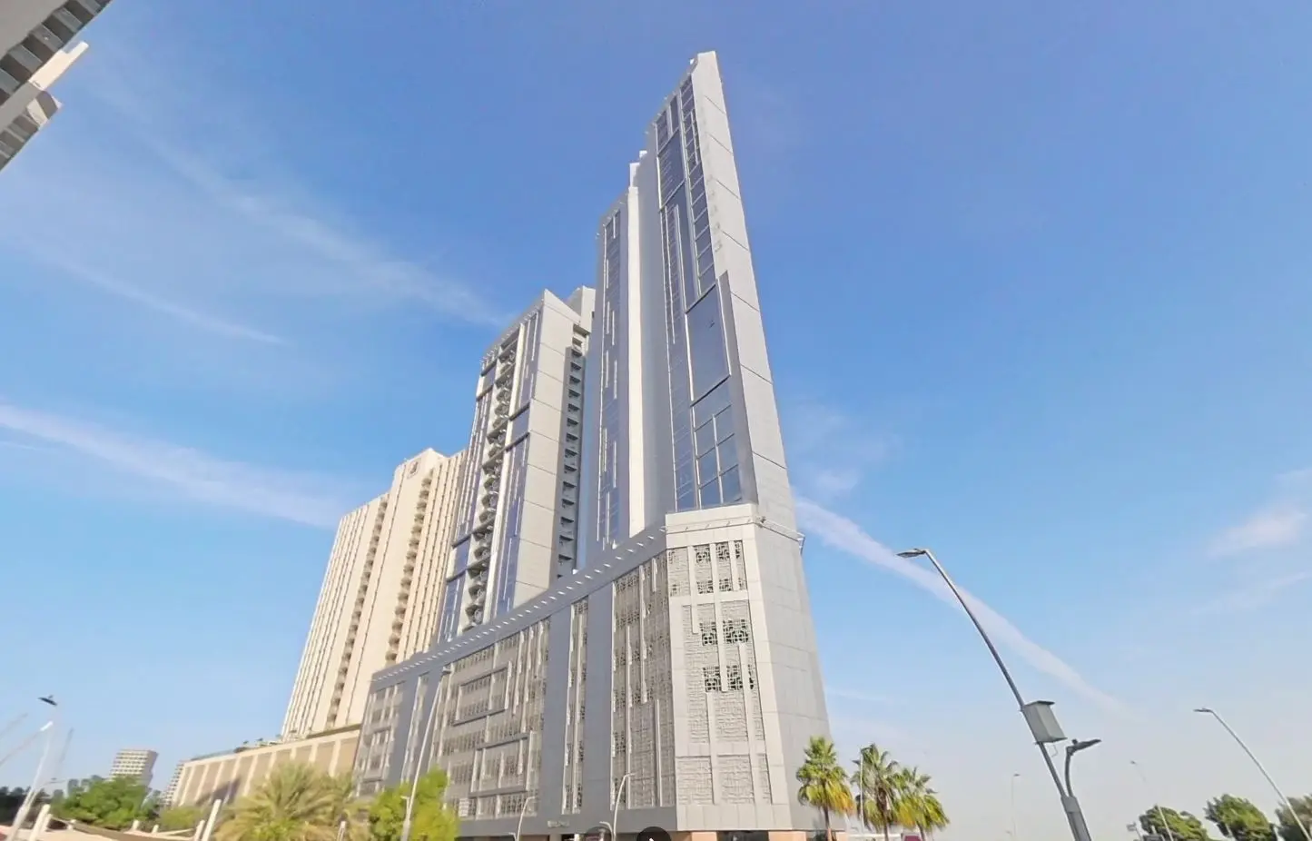 Contemporary twin residential tower exterior façade of Al Jeel Towers in Shams Abu Dhabi on Al Reem Island.