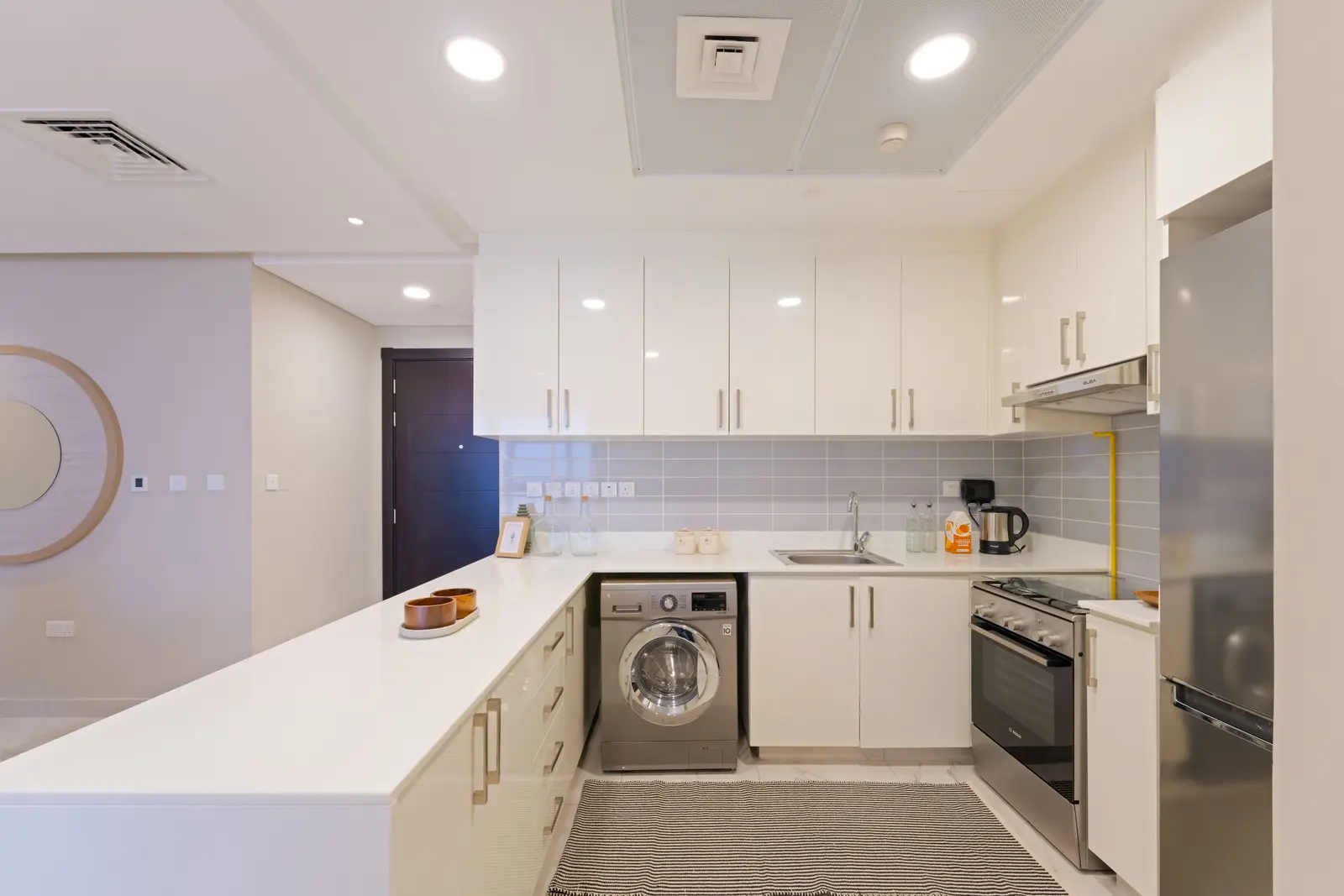 Contemporary kitchen at Leaf Tower featuring sleek cabinetry and quality finishes.