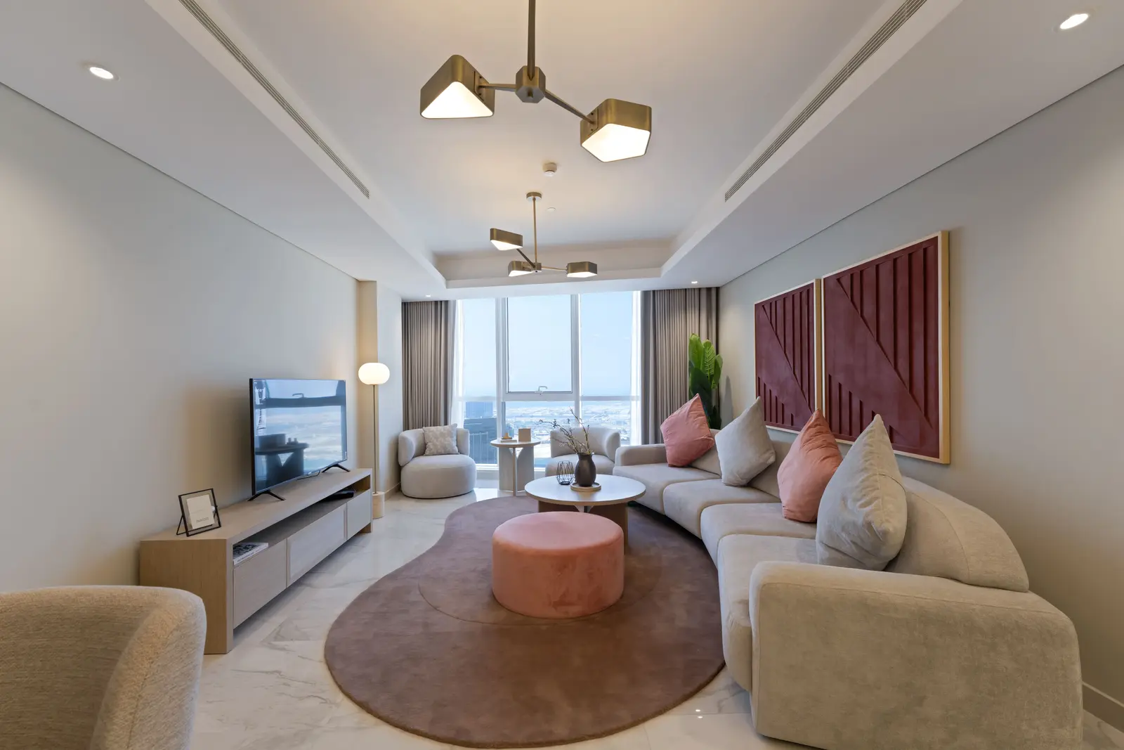 Bright open-plan living room at Leaf Tower overlooking Al Reem Island.