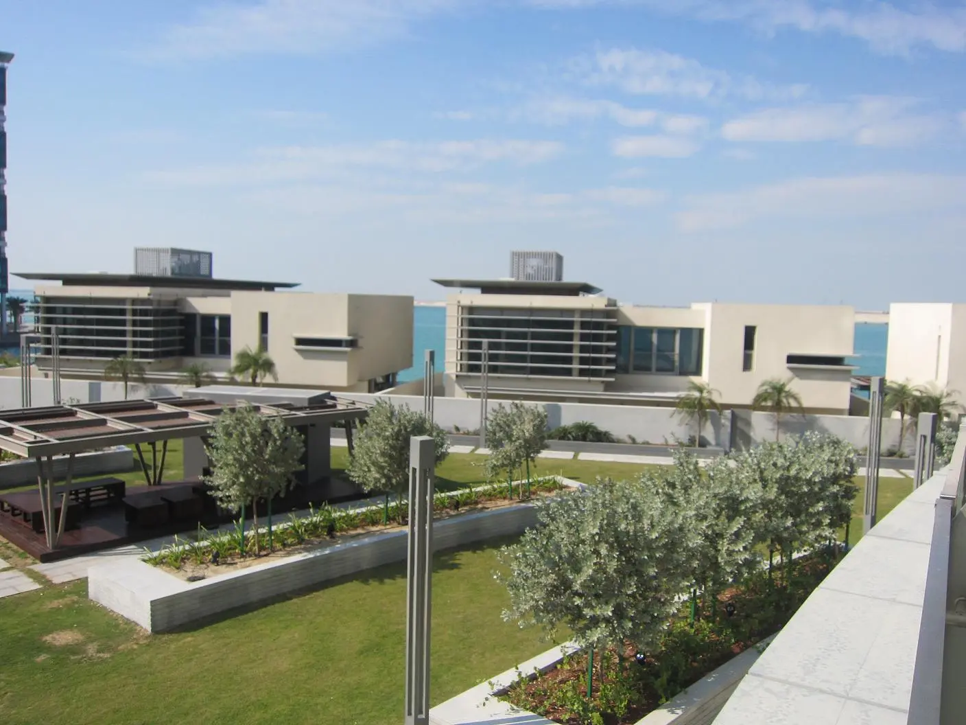 Aerial perspective of Al Muneera apartments and villas on Al Raha Beach Abu Dhabi coastline.