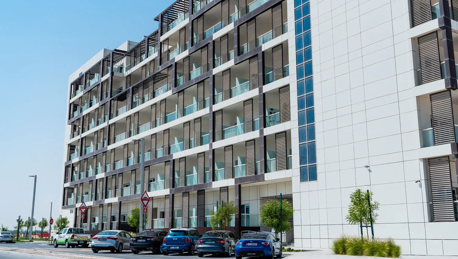 Leonardo Residences exterior in Masdar City Abu Dhabi featuring contemporary residential architecture and modern building façade