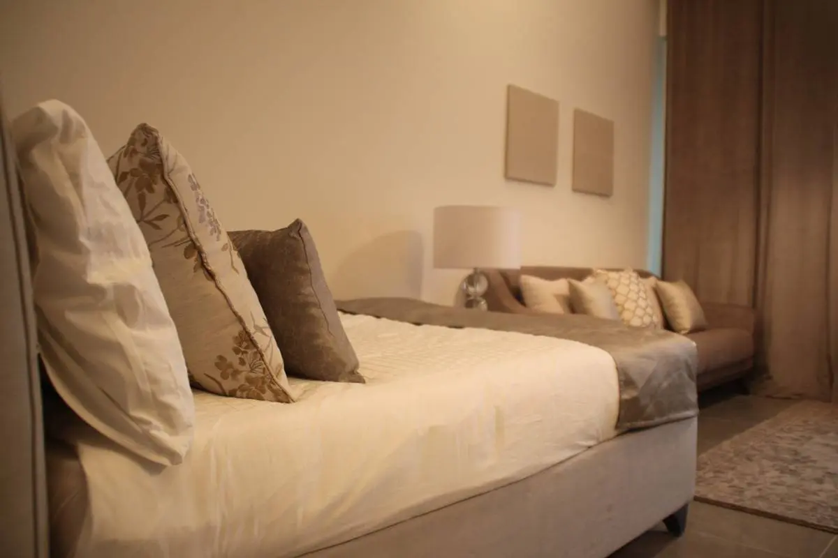 Leonardo Residences spacious living room in Masdar City Abu Dhabi with contemporary interiors and premium finishes.jpg